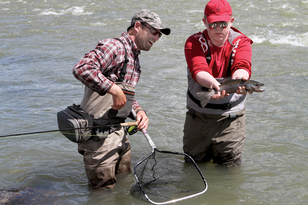 Students learn fly-fishing basics from local guides