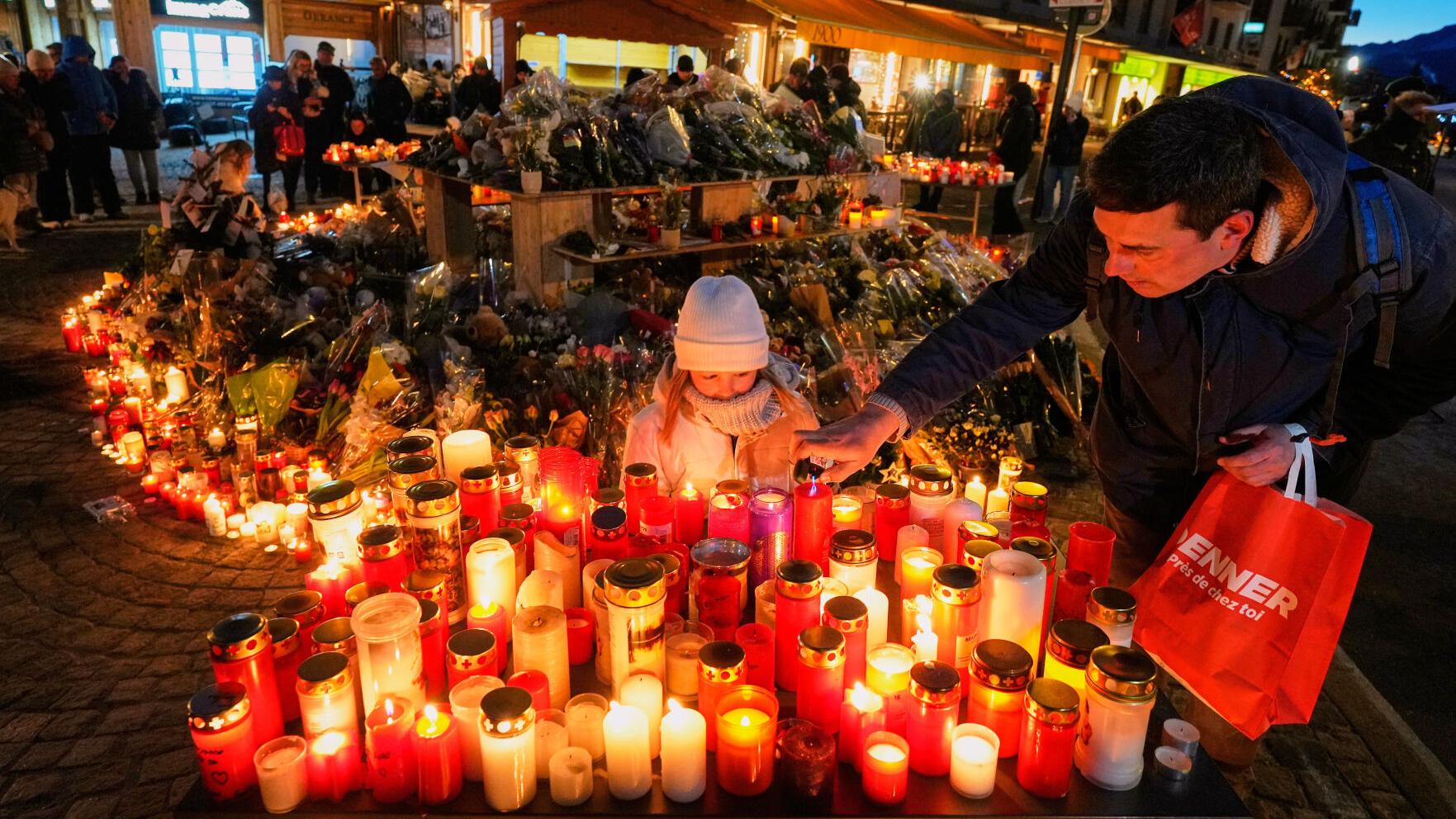 Switzerland honors the victims of the deadly Alpine bar fire in a ...