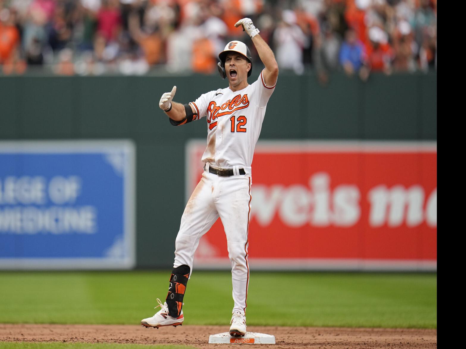 Baltimore Orioles second baseman Adam Frazier (12) safely reaches