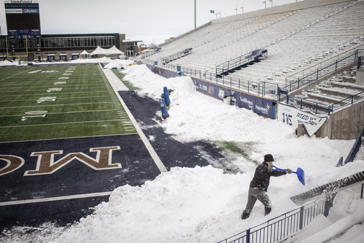 Grab a shovel: Volunteers pitch in to clear Bobcat Stadium of snow