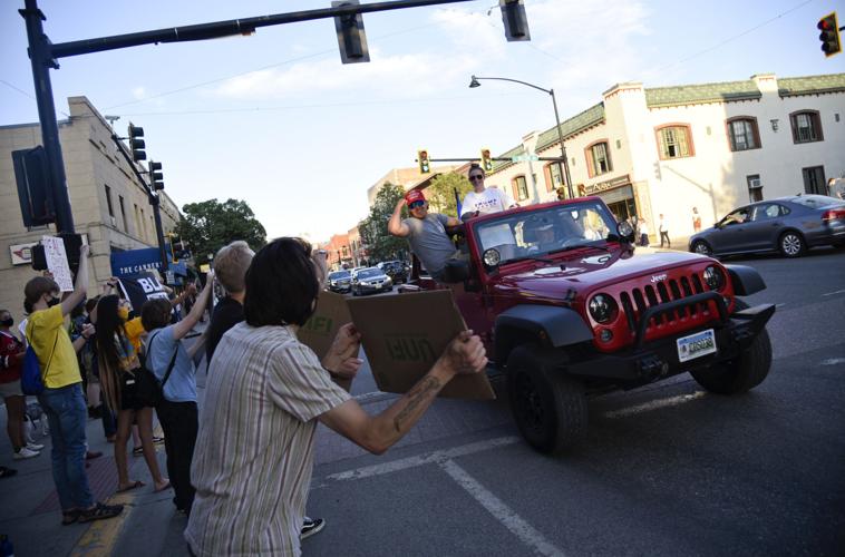 'Defend the Police' demonstrators clash with counter protesters at car ...