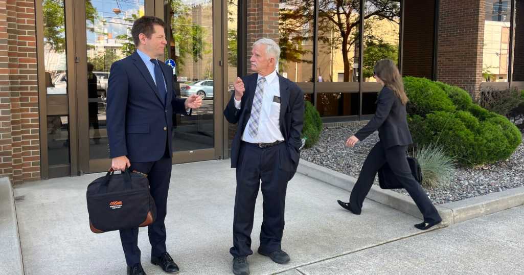 Federal judge weighs whether to bar commissioner from in-person work