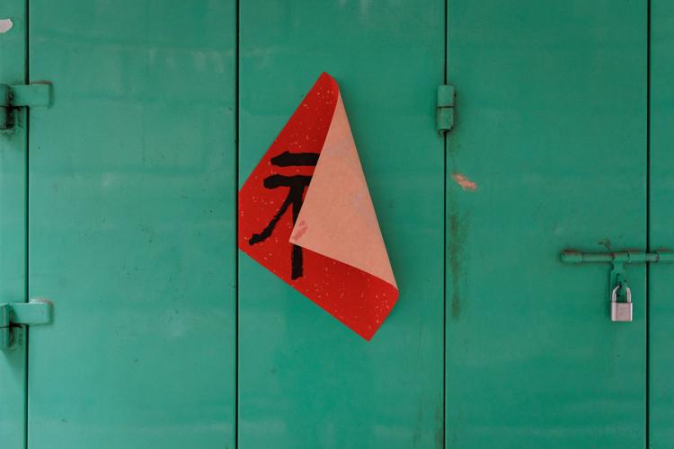 Photos follow the color red through public and intimate spaces during