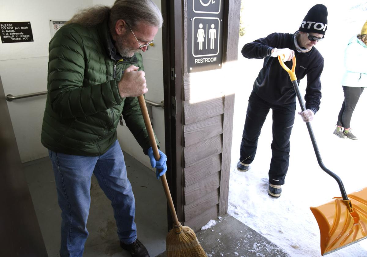 Volunteers clean restrooms, take out trash in Yellowstone amid