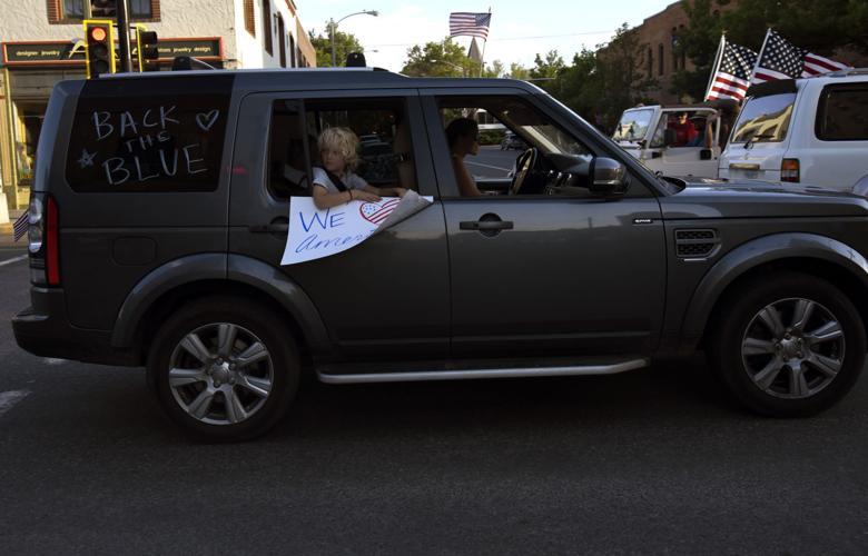 'Defend the Police' demonstrators clash with counter protesters at car ...