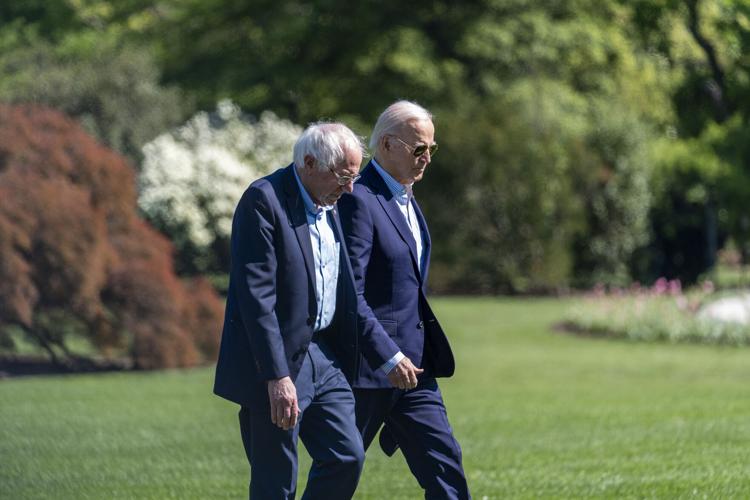 President Joe Biden stands with Sen. Bernie Sanders, I-Vt., after speaking about lowering health care costs in the Indian Treaty Room at the Eisenhower Executive Office Building on the White House complex in Washington, Wednesday, April 3, 2024.