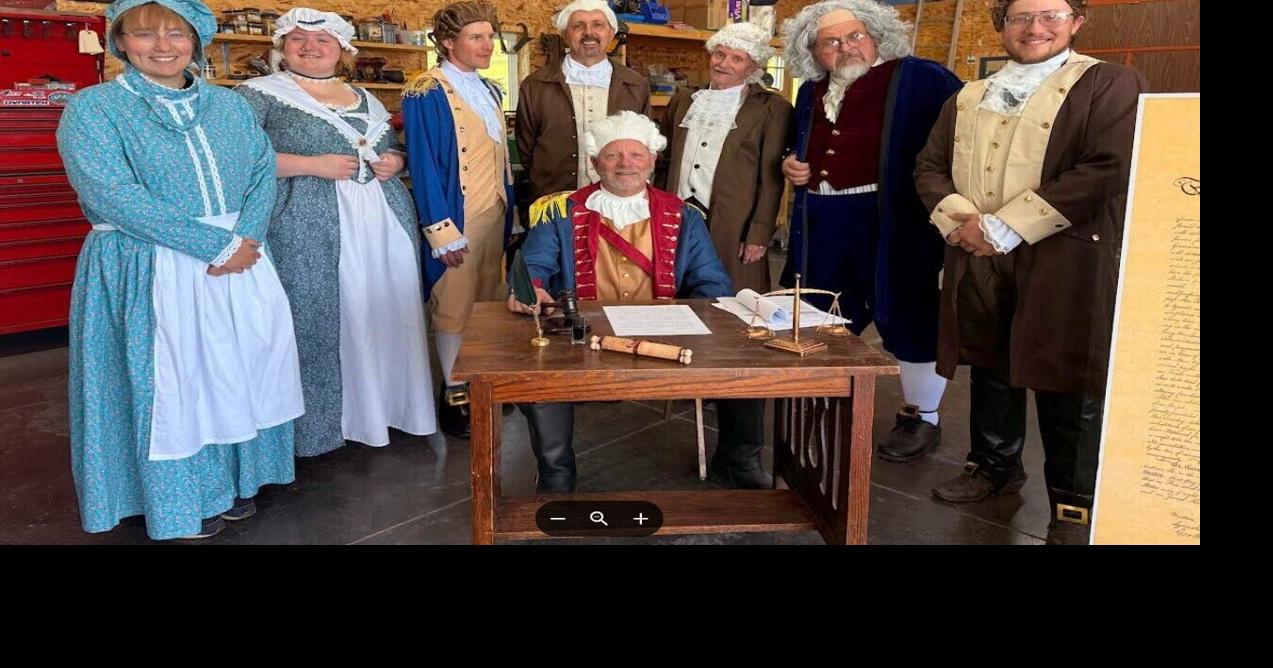 Local actors recreate the signing of the Declaration of Independence