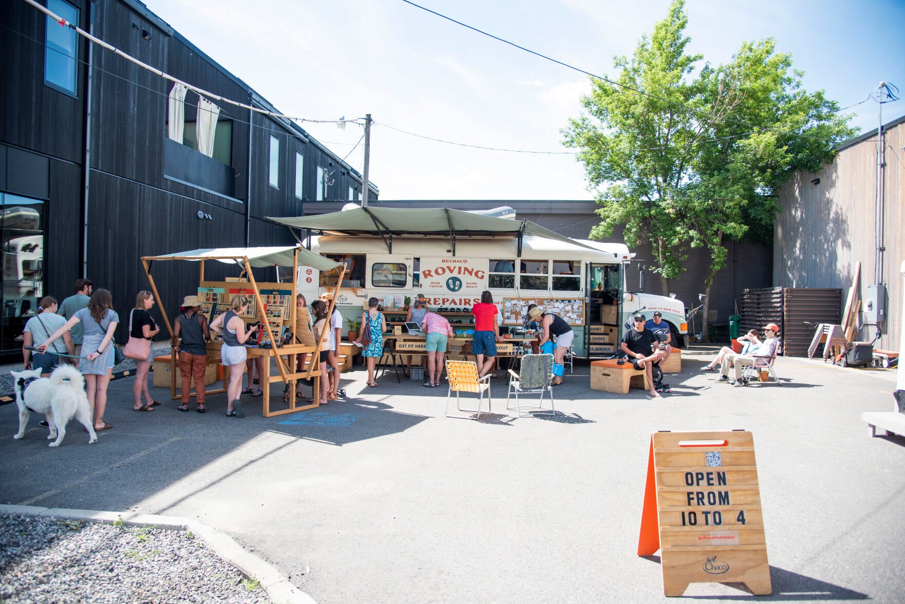 Chaco roving repairs bus stops in Bozeman during summer long tour