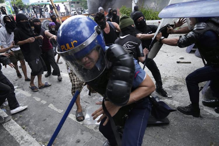 Philippine police arrested dozens after a violent clash near