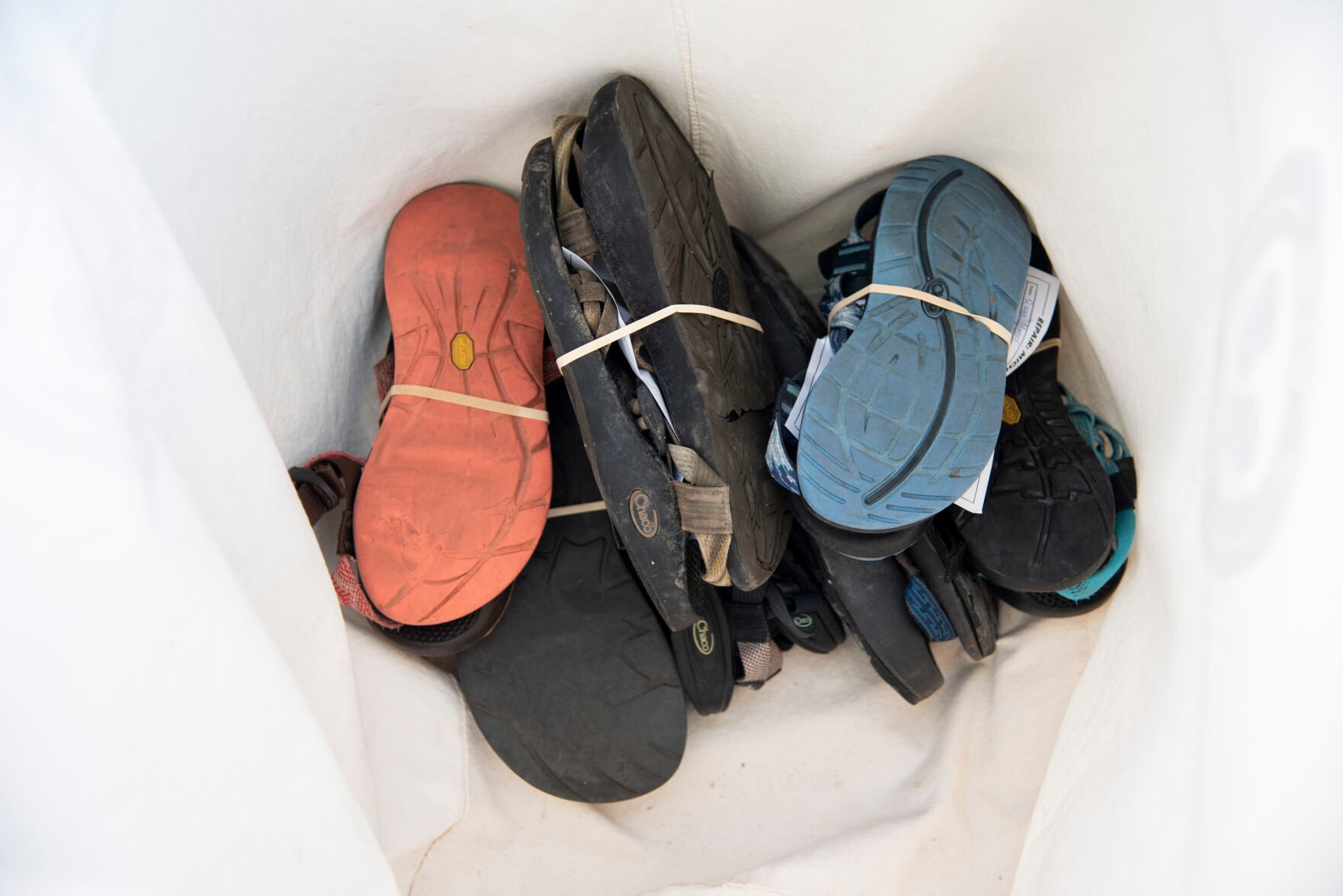 Chaco roving repairs bus stops in Bozeman during summer long tour