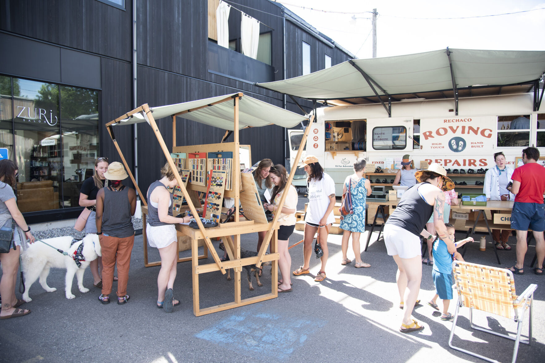 Chaco roving repairs bus stops in Bozeman during summer long tour