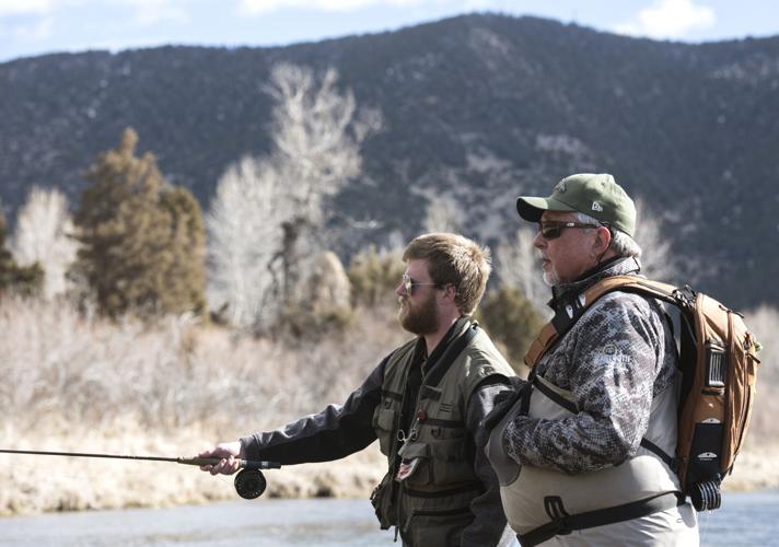 Flies and fun Group takes veterans fly fishing Environment