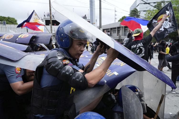 Philippine police arrested dozens after a violent clash near