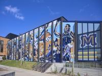 View Montana State’s Robert Rath designs large-scale mural outside Shroyer Gym to celebrate athletic success