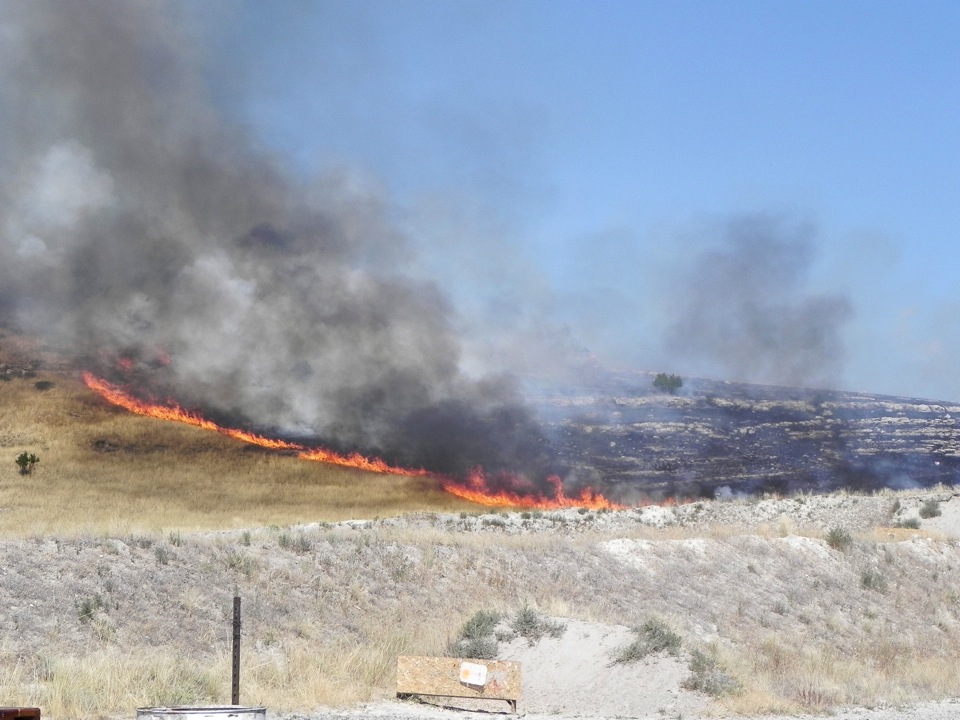 Brushfire extinguished near Logan gun range County
