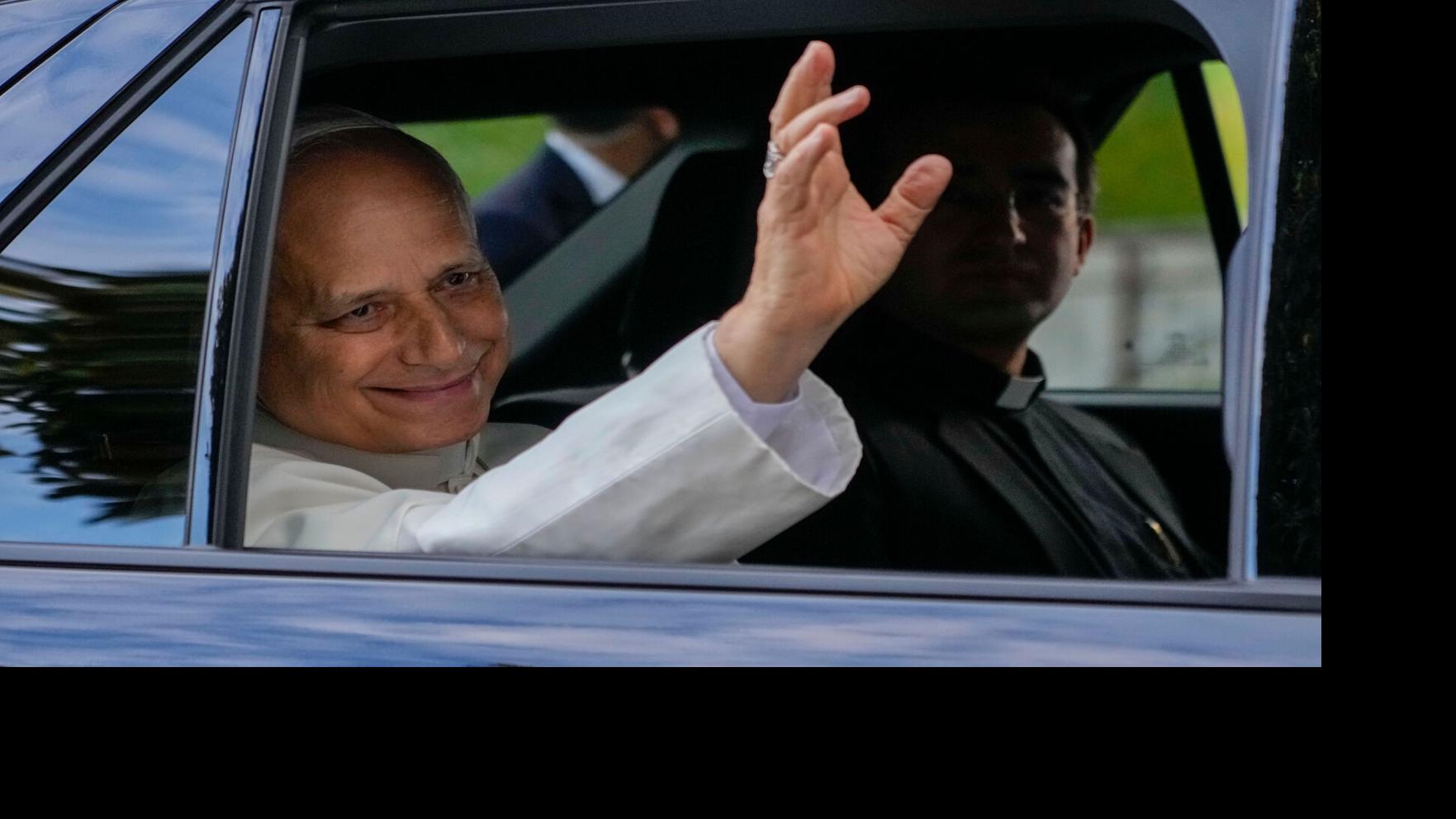 Pope Leo heads back to the Vatican as well-wishers cheer, in photos