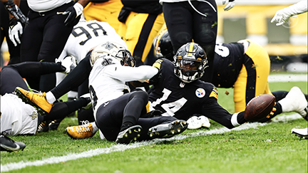 Pittsburgh Steelers quarterback Kenny Pickett (8) scores on a one-yard  quarterback sneak during the second half of an NFL football game against  the New Orleans Saints in Pittsburgh, Sunday, Nov. 13, 2022. (