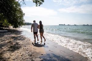 The quiet Ontario island home to historic stone walls has a soft sand beach with clear blue water