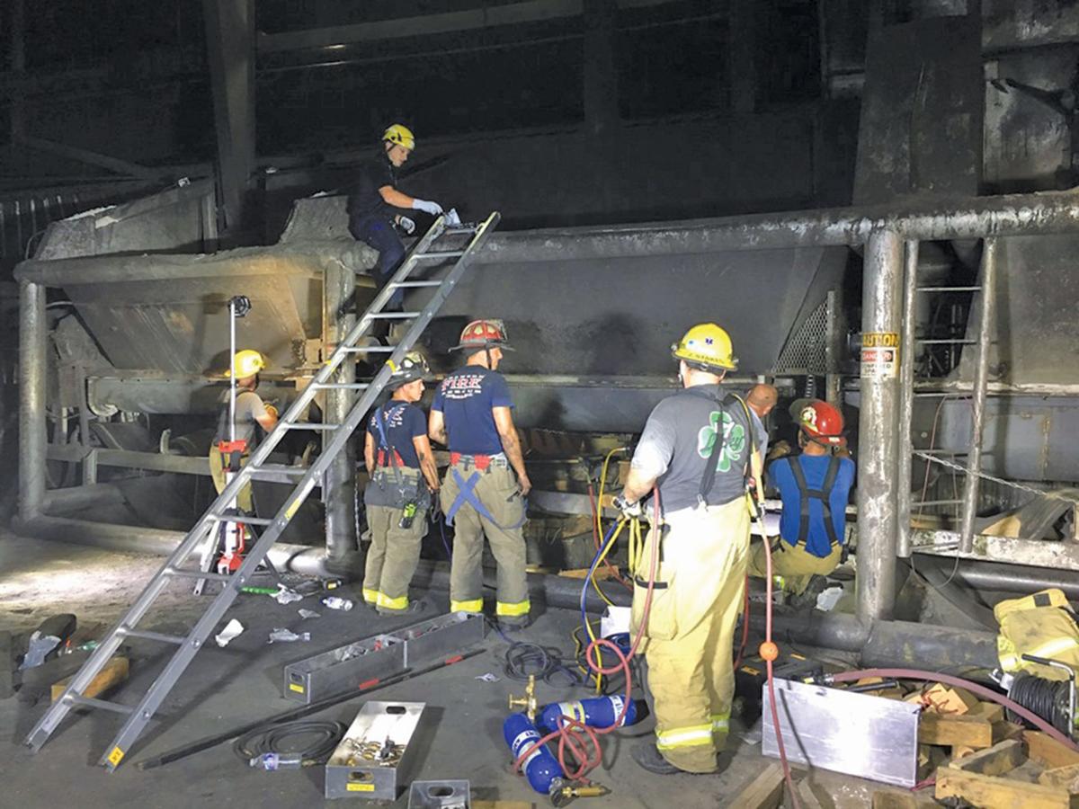 Trapped in an auger, royal oak charcoal employee rescued News Free