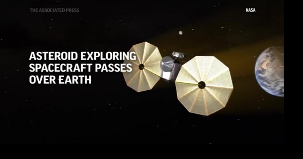 Asteroid exploring spacecraft passes over Earth