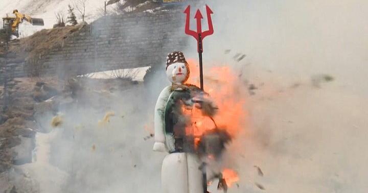 Exploding snowman announces warm weather in Switzerland