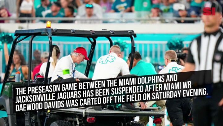 Daewood Davis of Dolphins carted off field after collision