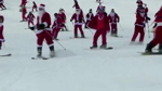 Skiing Santas cruise the slopes in Miane