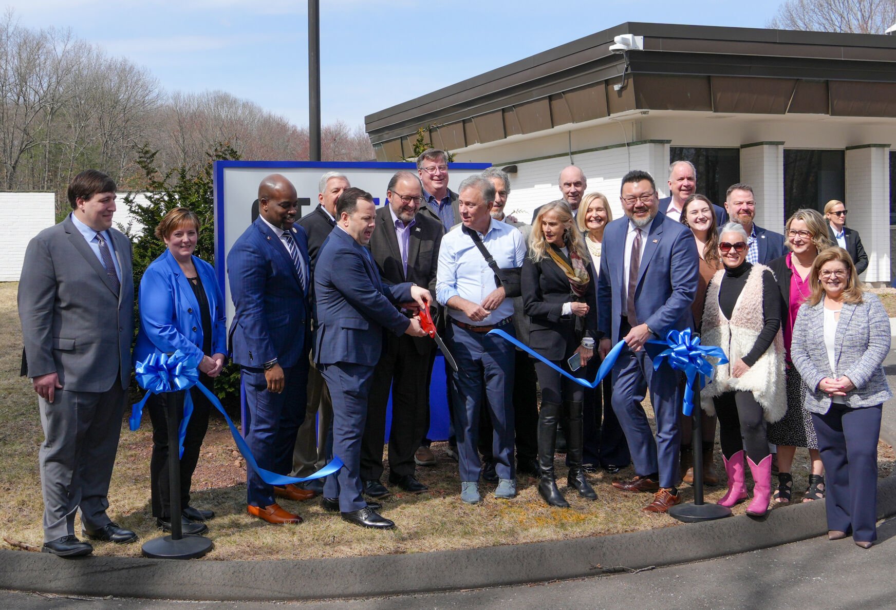 State and school officials cut the ribbon to open the new Advanced Manufacturing Technology Center at CT State Tunxis. CT State