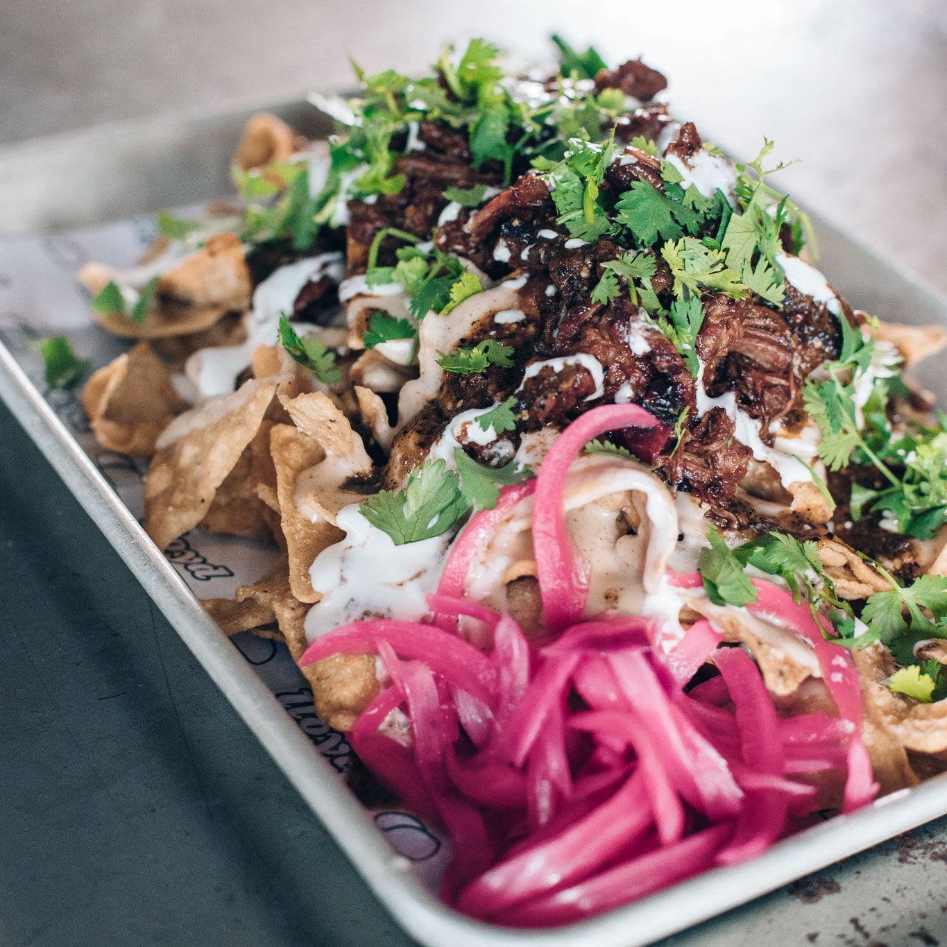 Dig In, Buffalo! Lloyd tricked out nachos with smoky braised beef