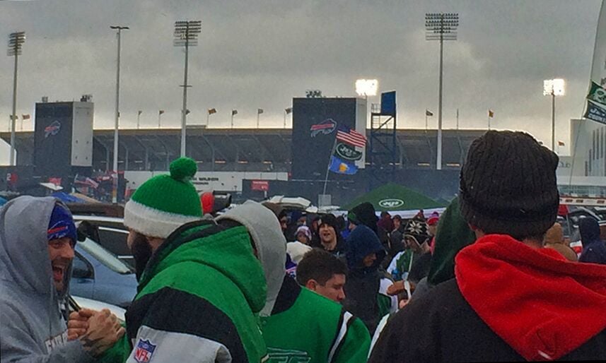 Watch: Bills fans throw each other through flaming tables before loss 