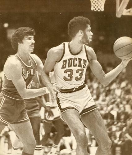 Bob McAdoo of the Buffalo Braves battles for position with Elvin