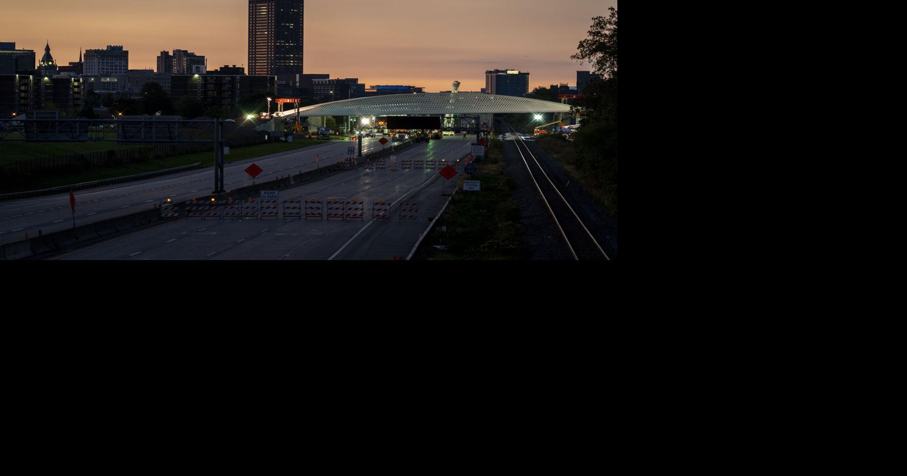 Onlookers give thumbs-up to Ralph Wilson Pedestrian Bridge installation