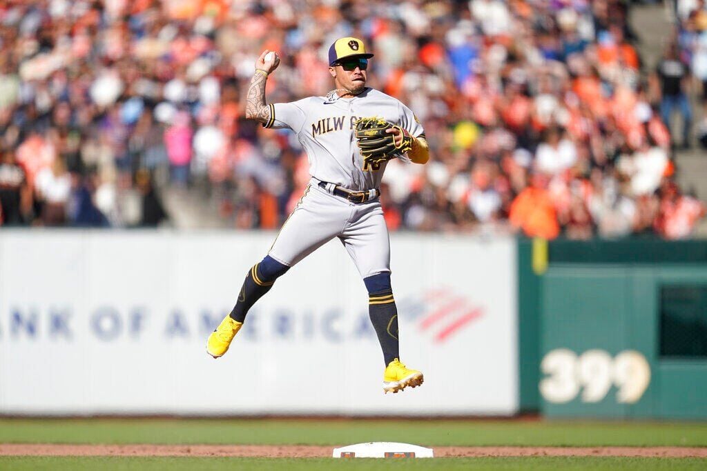 San Diego Padres second baseman Jake Cronenworth throws to first base for  an out in a baseball game against the Philadelphia Phillies, Saturday, June  25, 2022, in San Diego. (AP Photo/Derrick Tuskan