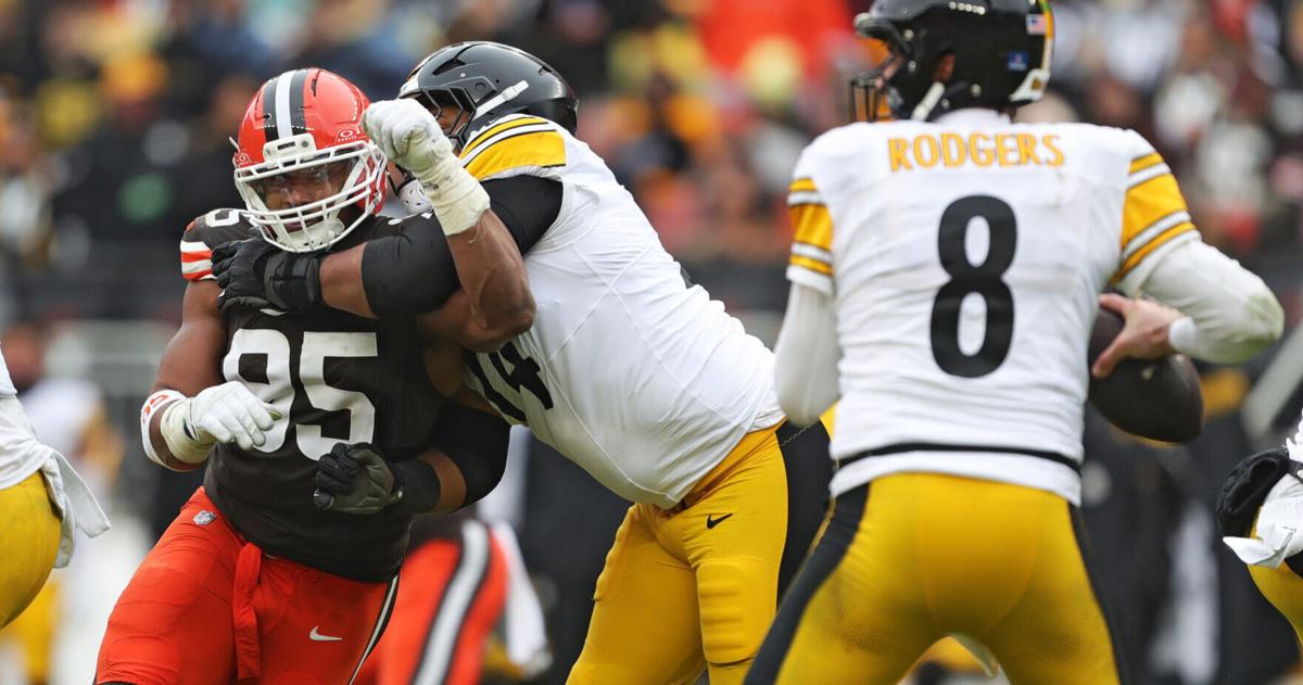 Cleveland Browns defensive end Myles Garrett (95) tries to get past Pittsburgh Steelers guard Spencer Anderson (74) as quarterback Aaron Rodgers (8) looks to throw during the second half of an NFL football game at Huntington Bank Field, Dec. 28, 2025, in C
