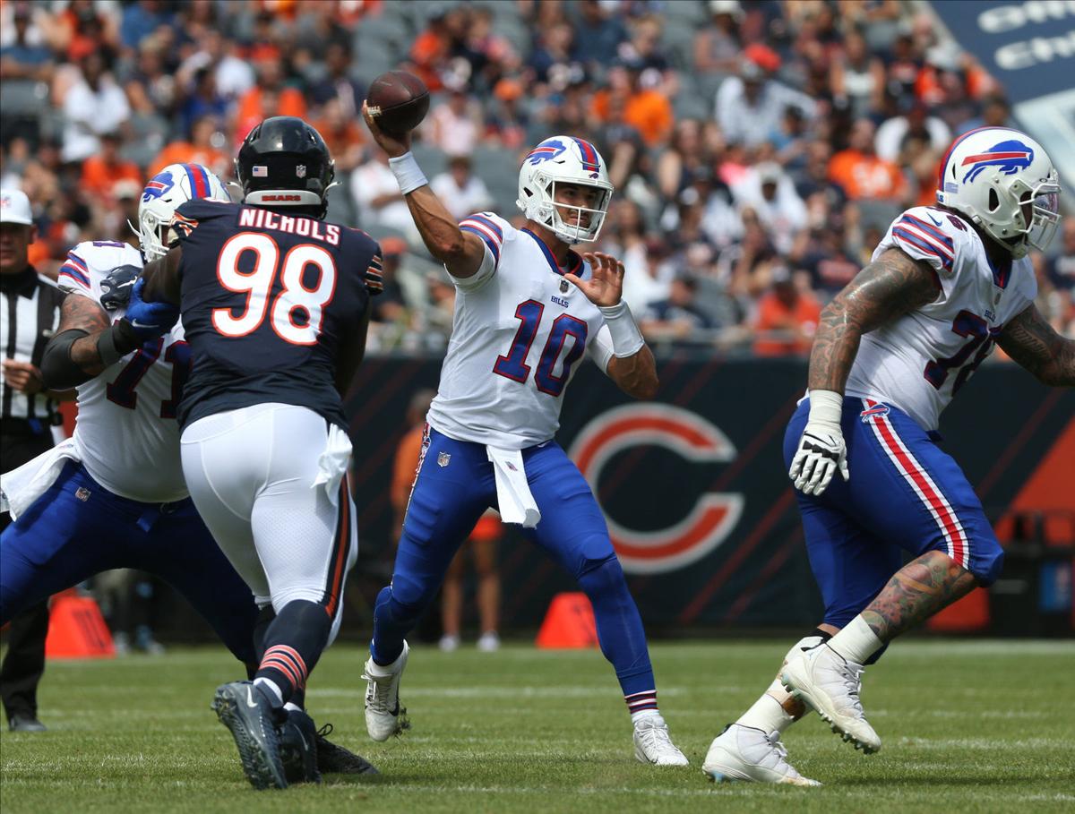 Buffalo Bills quarterback Mitchell Trubisky (10) rolls out of the pocket  after handing the ball off against the Washington Football Team during the  fourth quarter of an NFL football game, Sunday, Sept.