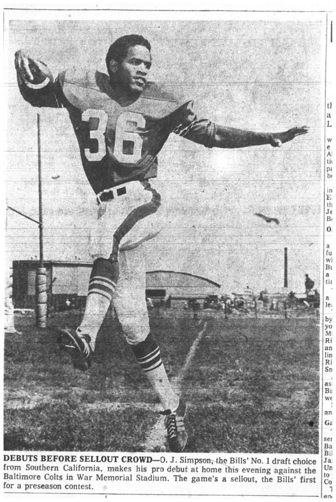 O.J. Simpson (32) sits alone on the Buffalo Bills bench while his defensive  squad battles the New York Giants in vain during final minutes of play  Monday night at Rich Stadium in