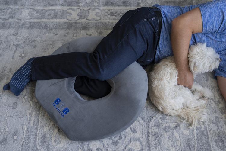 New Pillow Lets You Nap While Being Threatened by an Adorable Red