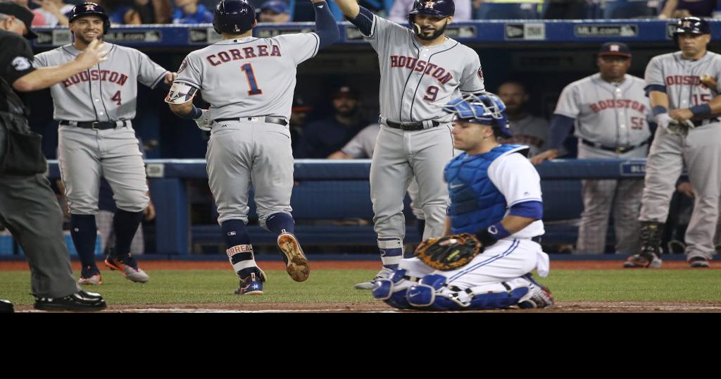 Houston Astros left fielder Marwin Gonzalez, from left, Carlos Correa and  George Springer celebrate their win against the Los Angeles Dodgers during  Game 2 of baseball's World Series Wednesday, Oc …