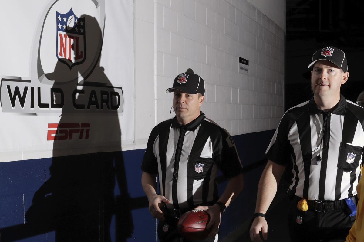 NFL referee Ed Hochuli (85) look over a replay during an NFL football game  between the Atlanta Falcons and the Dallas Cowboys, Sunday, November 12,  2017, in Atlanta. The Falcons won 27-7. (