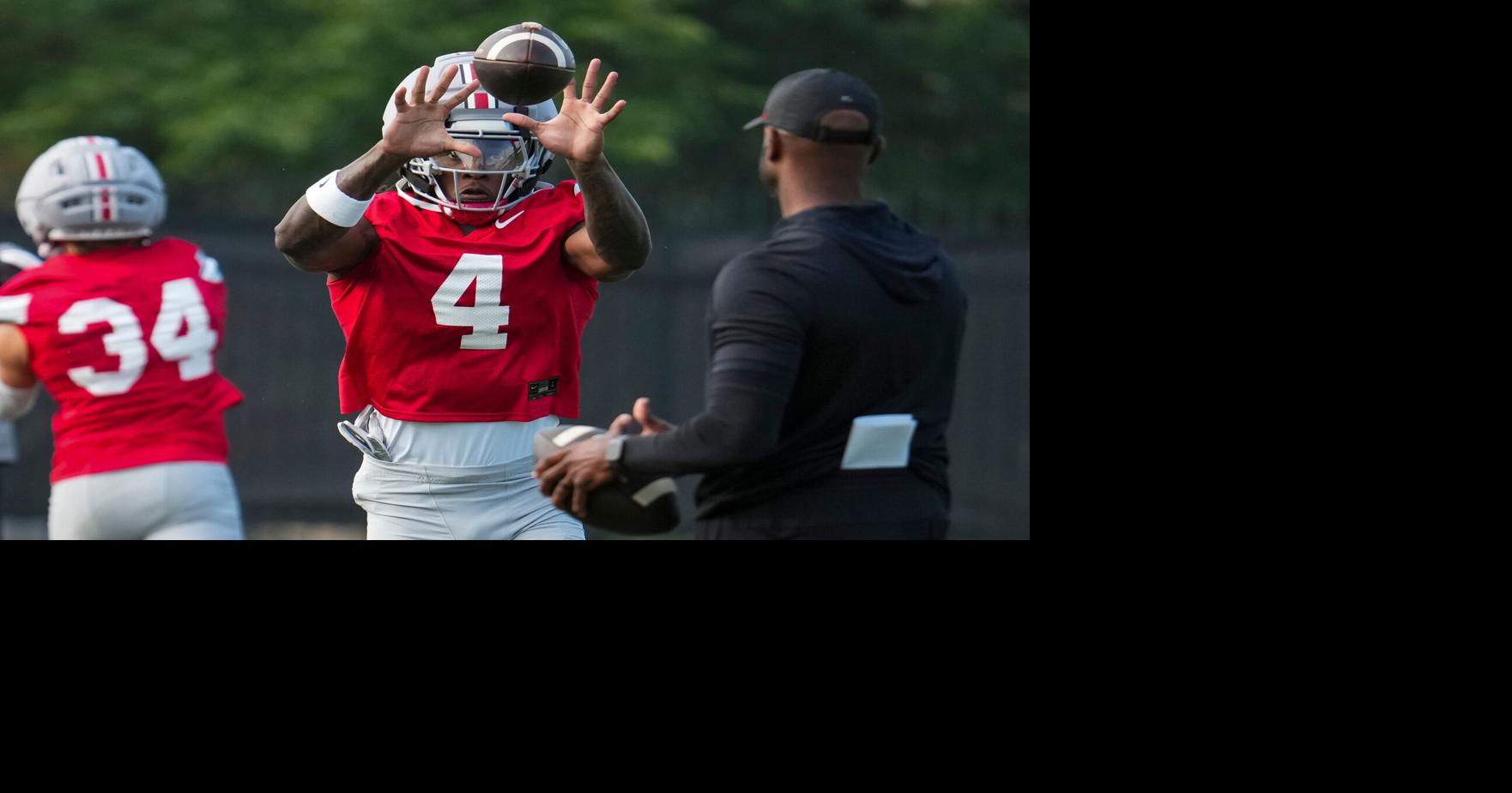 Ohio State Buckeyes wide receiver Jeremiah Smith (4) catches a pass during the first practice of training camp at the Woody