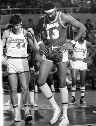 Bob McAdoo of the Buffalo Braves battles for position with Elvin