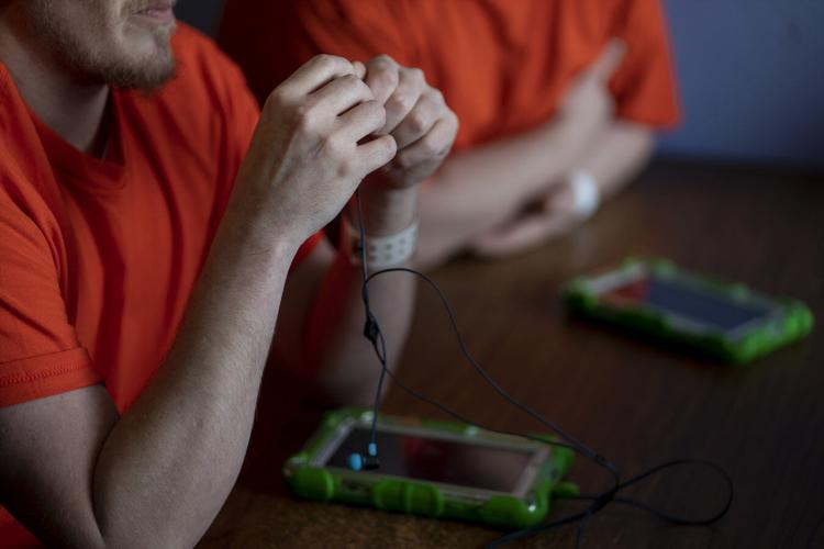 Behind bars and online Computer tablets for inmates seen as tool to