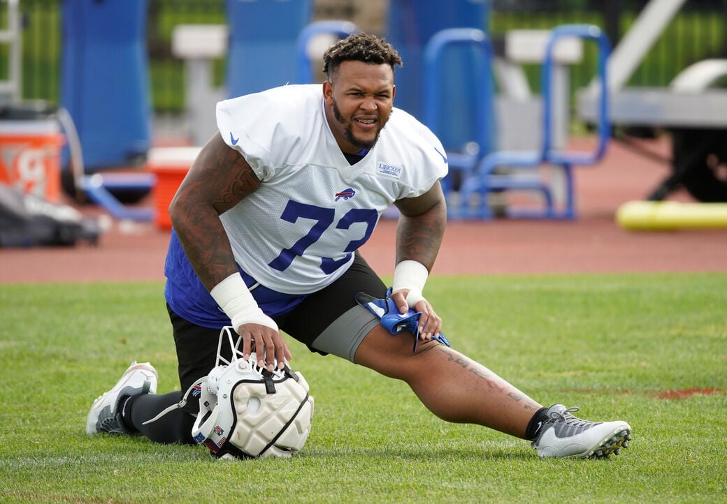 Bills left tackle Dion Dawkins returns to training camp practice, and ...