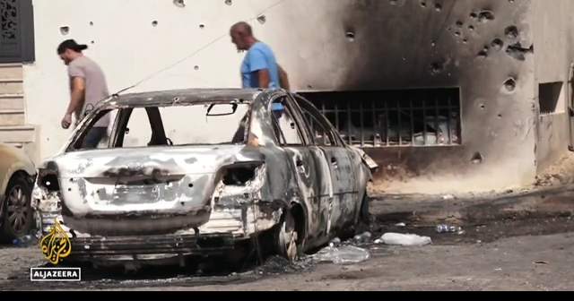 Libya unrest: Tentative calm after violent Tripoli clashes killed at least 32