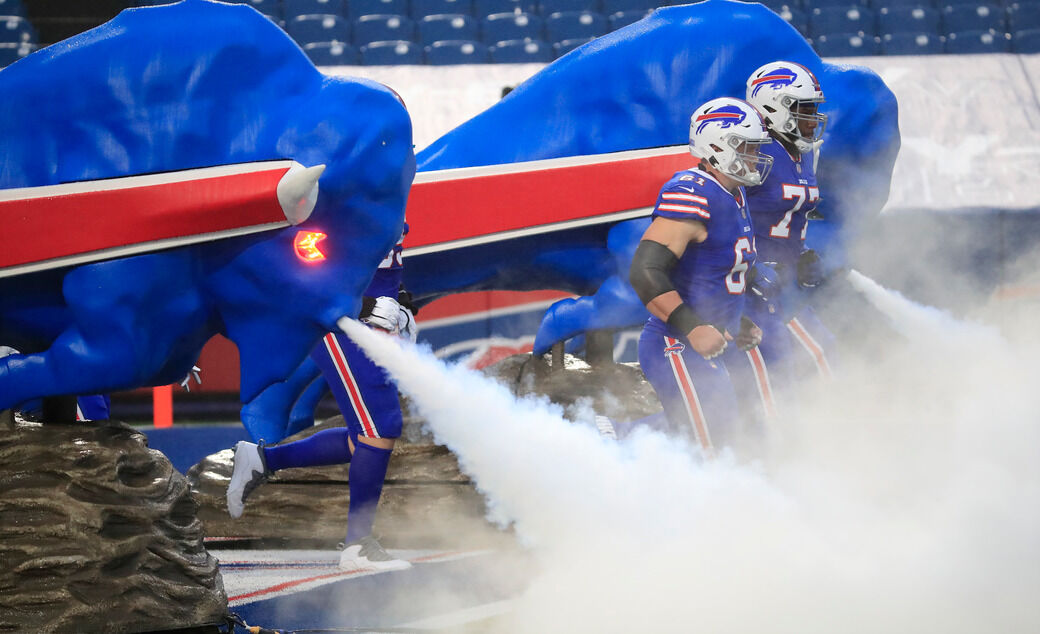 Bill Cowher joined the Bills Mafia by jumping through a table