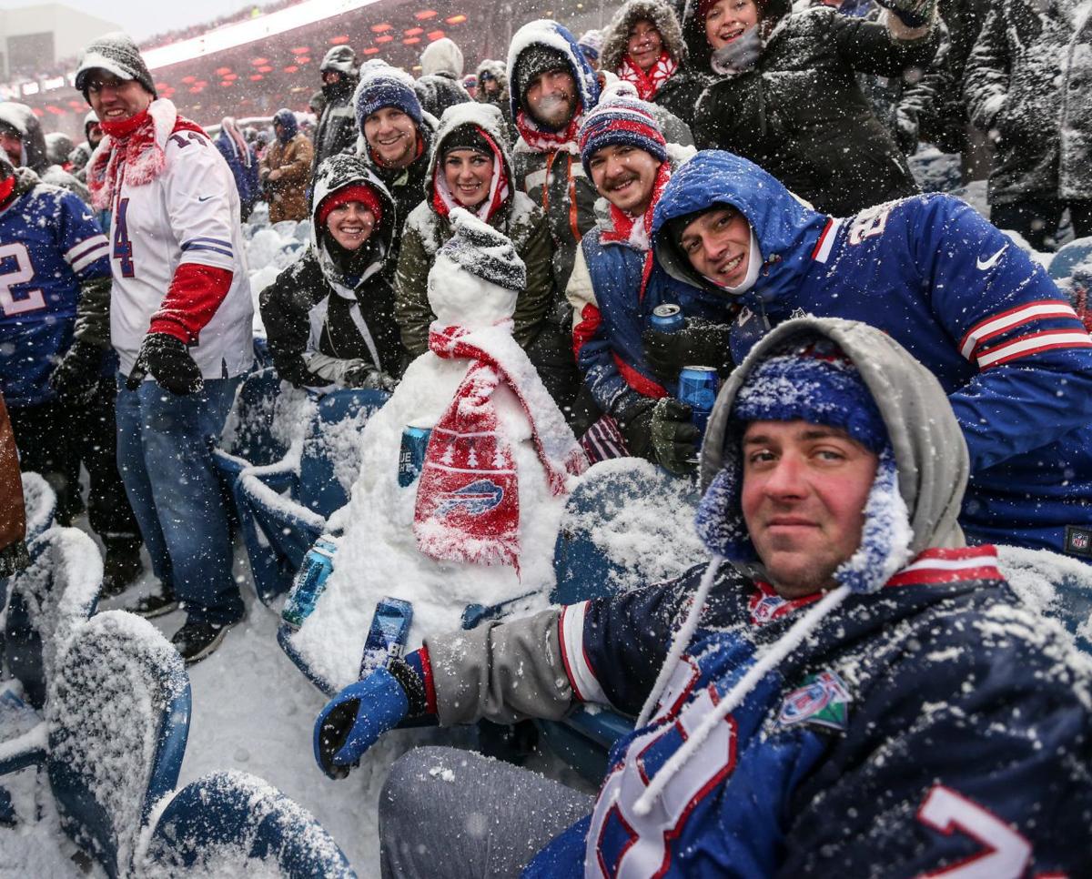Bills fans build snowmen on sidelines during Bills vs. Colts game
