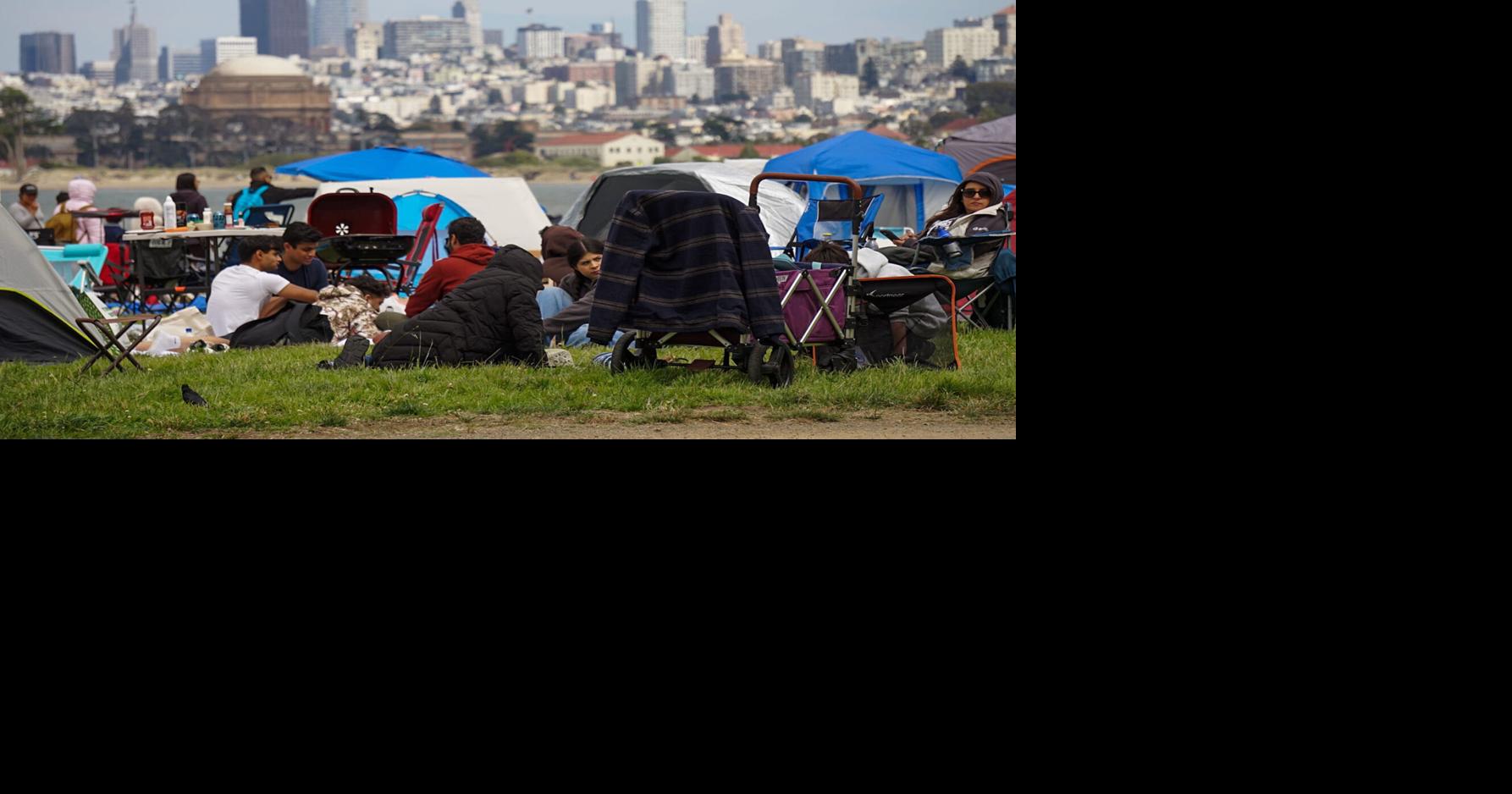 Folks relax along Crissy Field hours before the City of San Francisco's scheduled fireworks show, on Saturday, July 4, 2026, in San Francisco, CA.