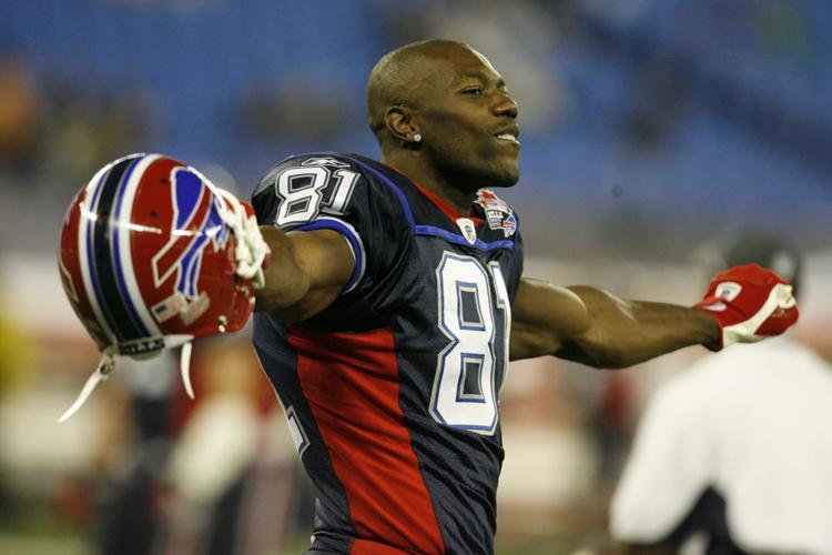 30 July 2009: Wide Reciever Terrell Owens of the Buffalo Bills unveils the  new throwback uniforms after the Bills Thursday night practice at St. John  Fisher College in Pittsford, New York. (Icon