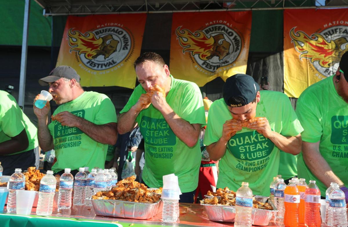 Defending chicken wing champ devours fifth straight title at Wing Fest