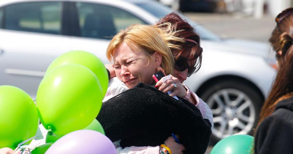 Mother charged with trying to run over driver who killed her son